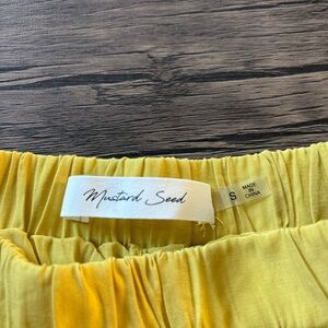 Mustard Seed flowy mini skort with tiered Fabric. Mustard color